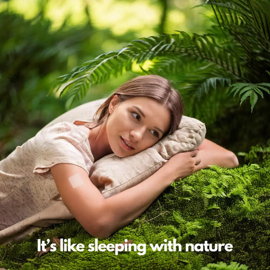 Woman peacefully lying on moss outdoors with caption "It's like sleeping with nature".