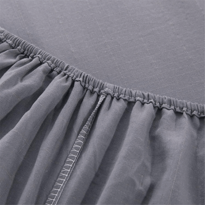 Close-up of elasticated corner of fitted grounding bed sheet showing quality stitching.