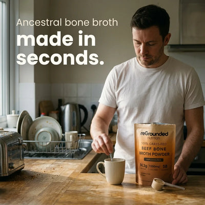 Ancestral bone broth made in seconds: a man stirring reGrounded grass-fed beef bone broth powder into a mug in his kitchen
